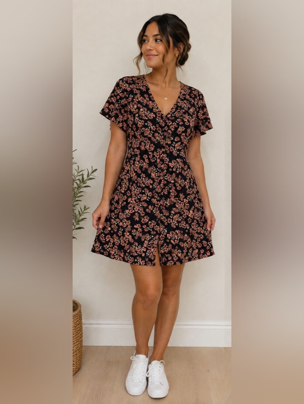 Women's floral top with tags visible